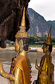 Luang Prabang, Laos - The Pak Ou Caves, the lower cave called Tham Ting. The caves, a Buddhist pilgrimage site, are a repository of old Buddha statues. 